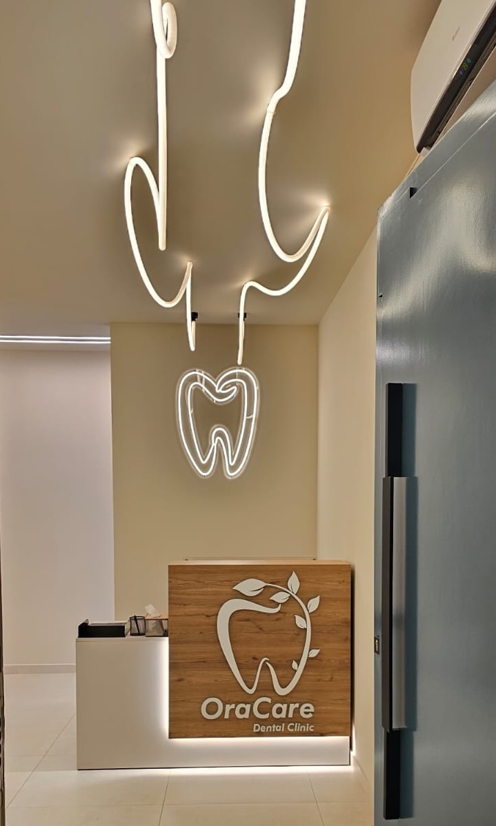 Reception desk with timber front and sculptural neon lighting